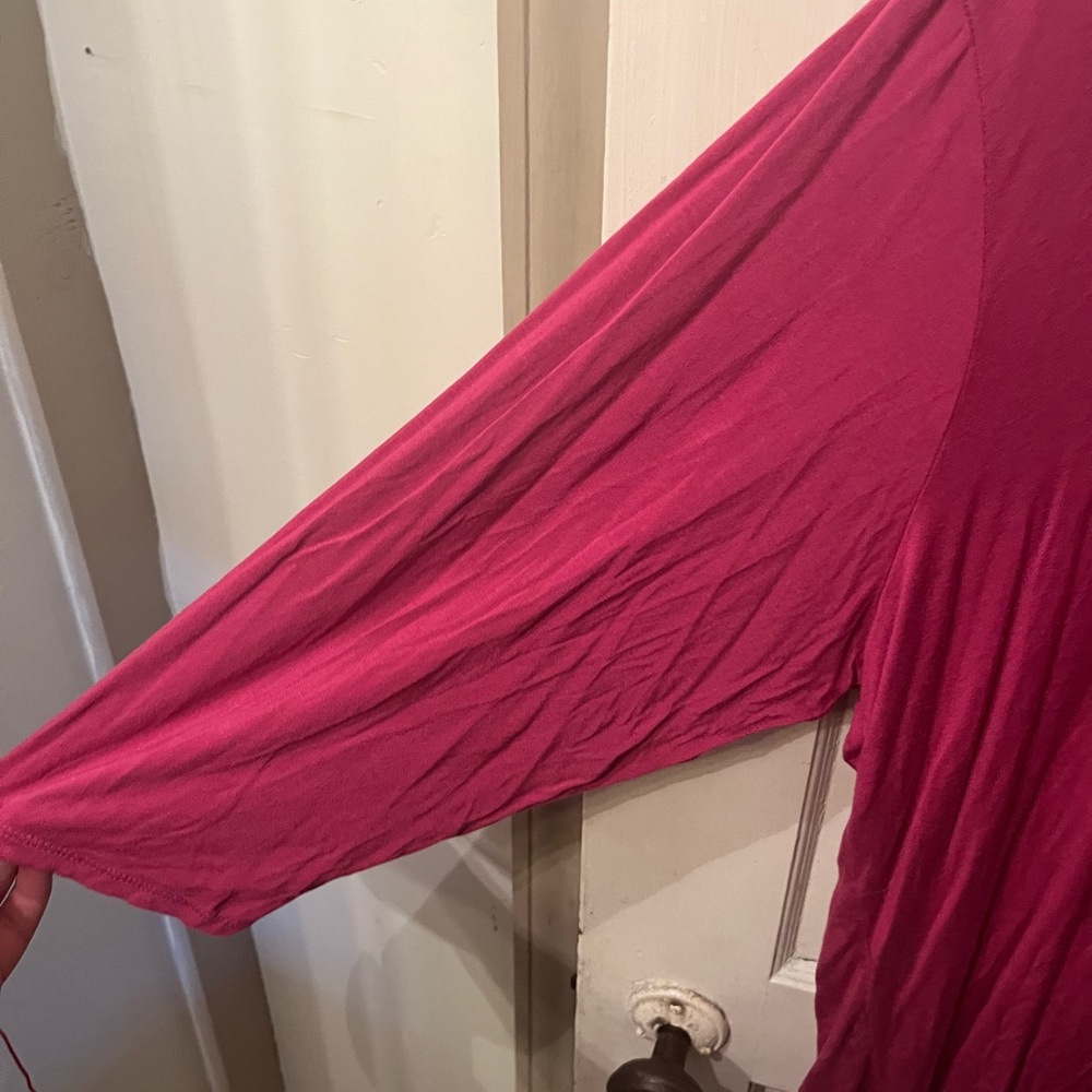 Pink cropped Cable And Gauge crossed top.